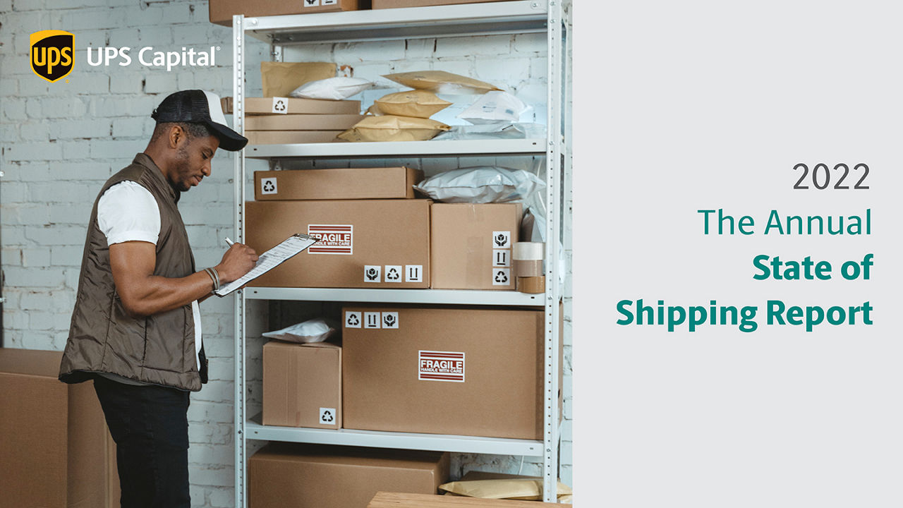 Male holding a clipboard in front of a shelf loaded with packages