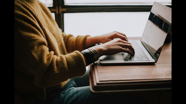 woman sitting at a laptop