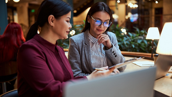 Two women having a business discussion in a restaurant