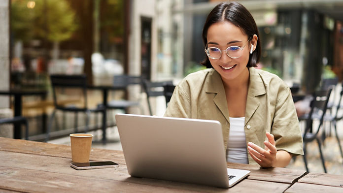 Female working on her laptop at a cafe